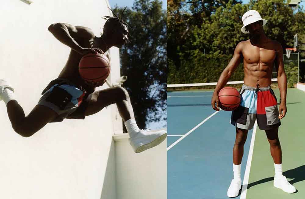 A man is jumping in the air with a basketball.