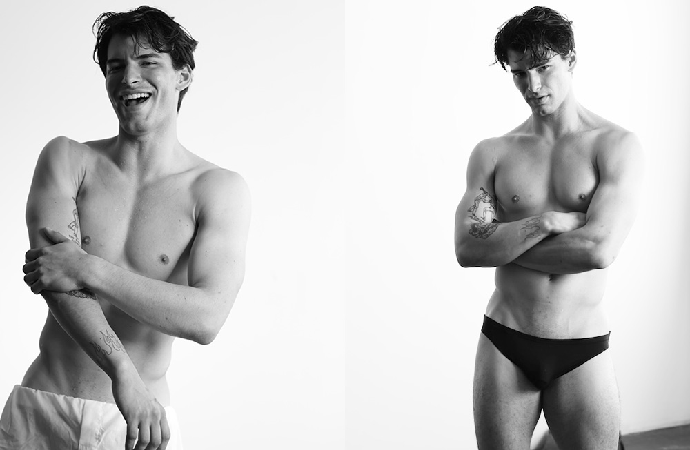 Black and white photo of two shirtless men posing confidently in briefs.
